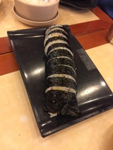 No, it isn't sushi. It's kimbap. What's the difference? Instead of fish, kimbap contains the American delicacy, Spam.